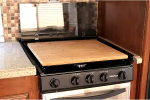 Camco Camper/RV Silent Top Stovetop Cover - Features Natural Bamboo Design w/Non-Toxic Protective Finish & 4 Non-Slip Rubber Feet - Fits Most 3 or 4 Burner RV Stoves | 19.5” x 17” x .75” (43571)